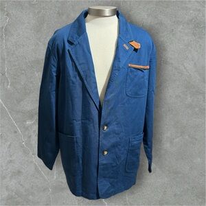 Orvis , Navy jacket with tan leather patch detail .